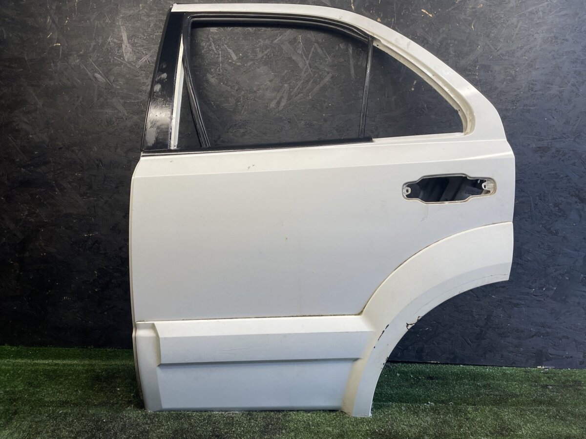 Двері задні ліві KIA Sorento JC (2002-2009) 770033E111